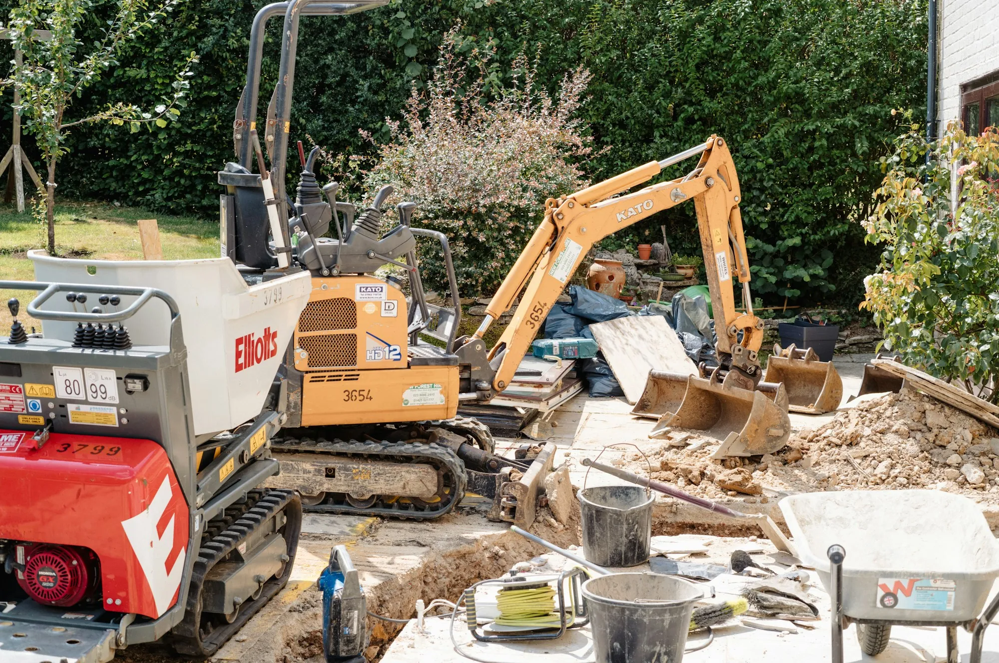 Compact excavator working on a demolition job